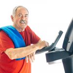 Healthy senior man on a treadmill enjoying the benefits of exercise